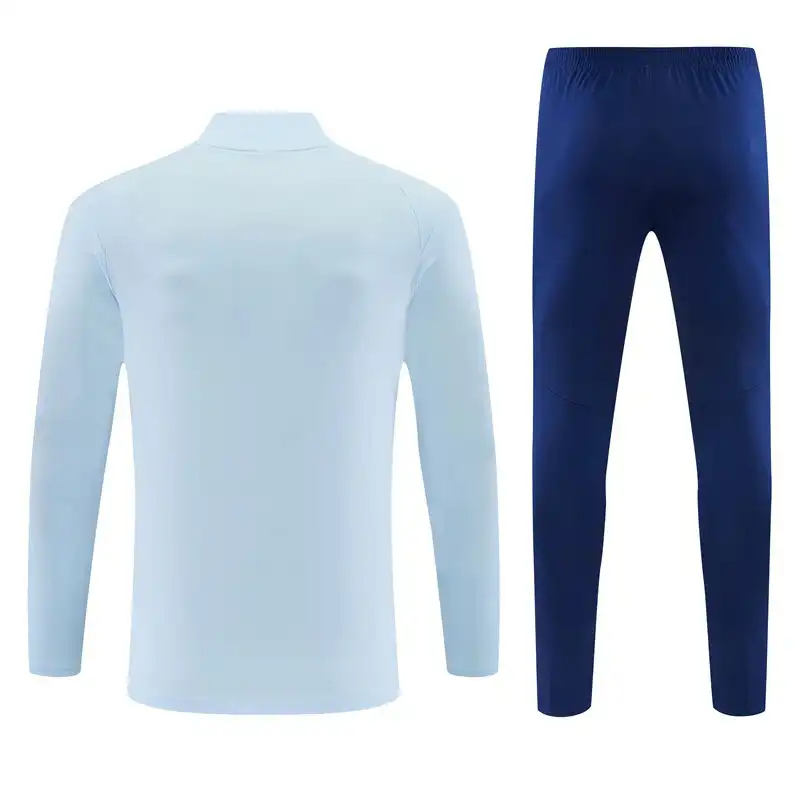 Manchester-City-Trainingsoberteil mit kurzem Reißverschluss am Kragen und Hose in Himmelblau/Marineblau 2026/27 – Rückansicht